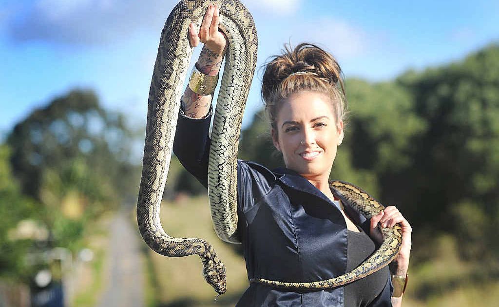 Tess Arnold with Venus, her 3.5m coastal carpet python.